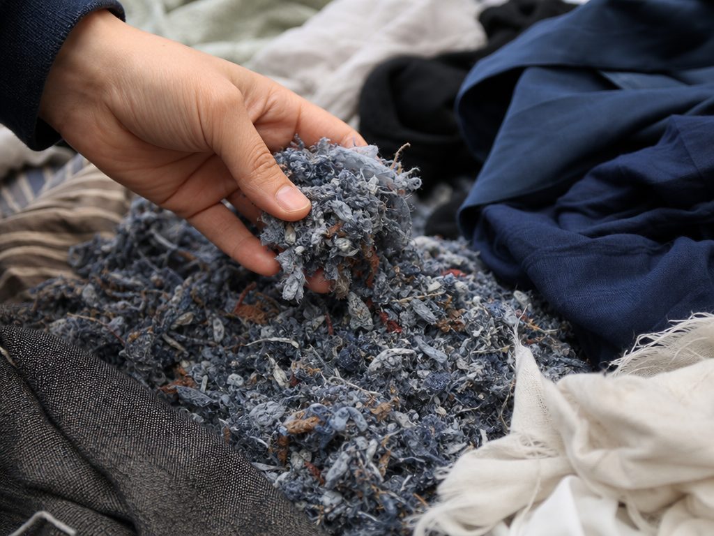 Redefining the Closet: How the Textile Industry is Embracing the Circular Economy (article editorial guide): a close-up detail shot of the subject